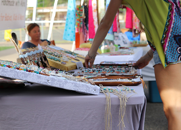Woman shopping at craft fair booth