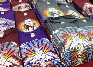 Stack of t-shirts with tribal designs
