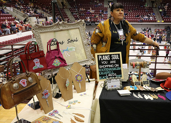 Woman selling jewelry and bags at a powwow