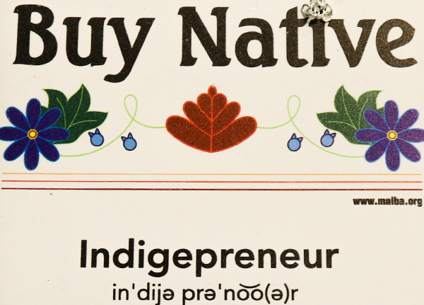 Sign that says 'Buy native - Indigepreneur'