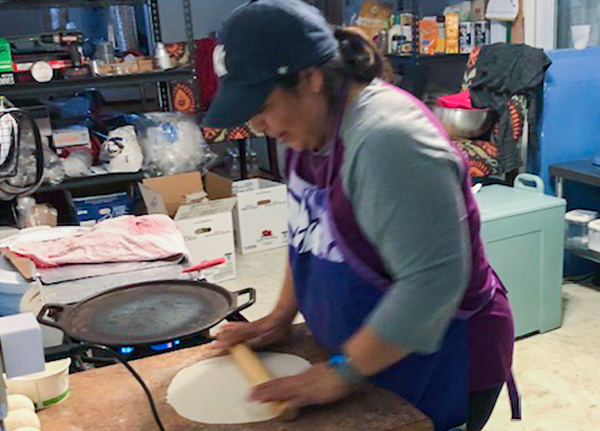 Woman rolling out dough
