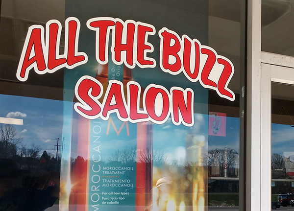 Window decal on All The Buzz Salon