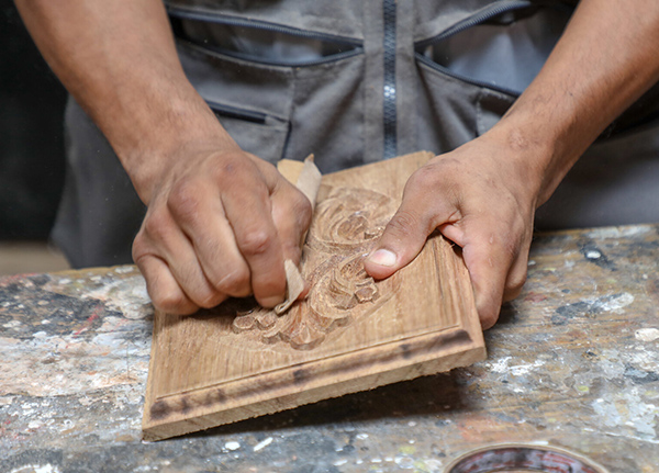 Hands carving wood plaque