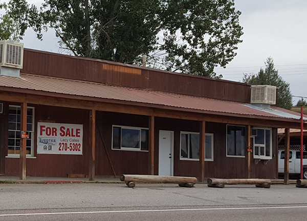 Building with for sale sign