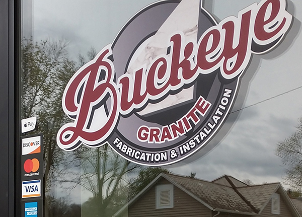 Company door with a logo that says 'Buckeye Granite Fabrication and Installation'