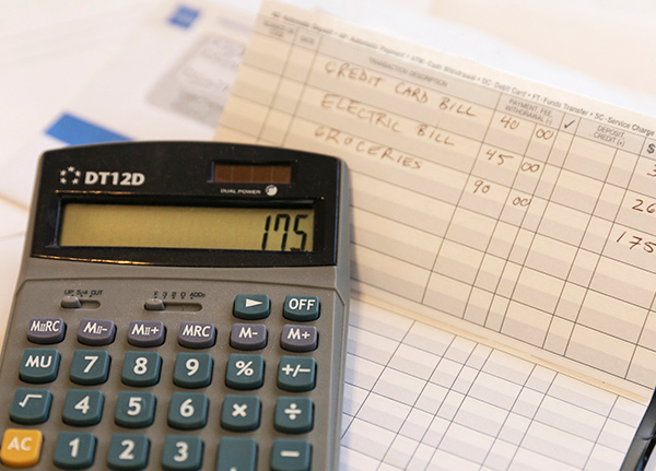 Checkbook register and a calculator