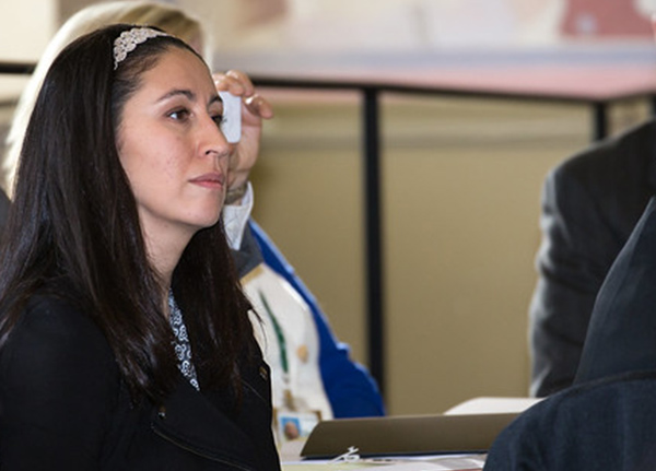 Woman focuses on someone out of frame