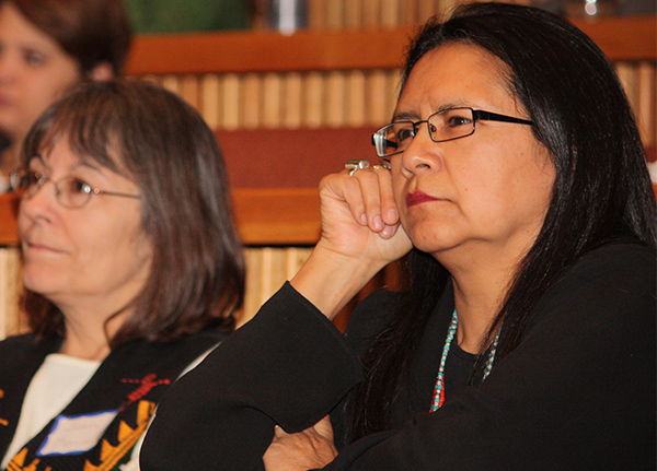 Woman thinking with her hand on her chin