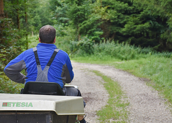 Man on riding lawn mower