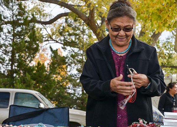 Woman selling goods at a road-side market