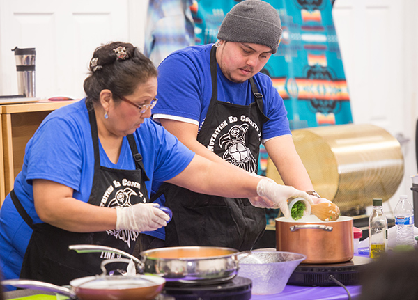 Young man and a woman cooking