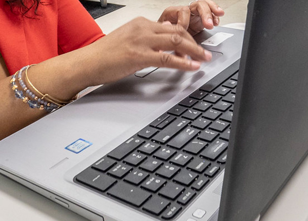 Person typing on laptop