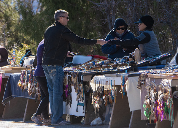 Man purchasing an item from a road-side market