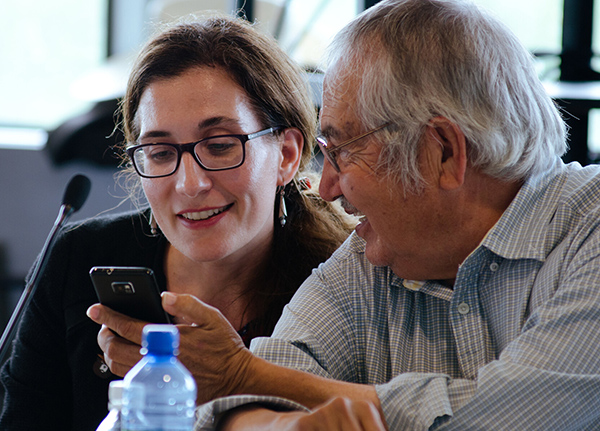 Two people looking at smartphone