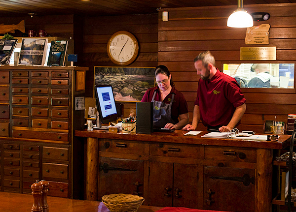 Restaurant with two workers behind the counter