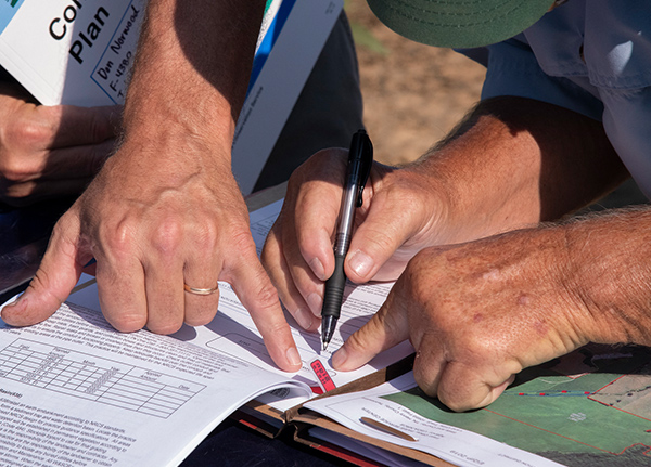 Person signs paper forms