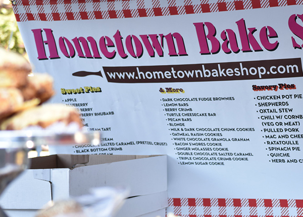 Sign with menu items at an outdoor market